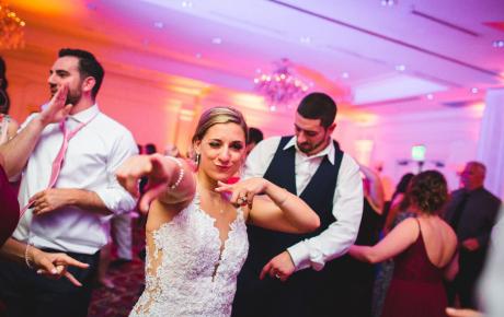 Bride celebrating on the dance floor 