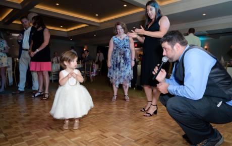 Wedding DJ interacting with the younger guests at Abenaqui Country Club - Rye NH. Photo by Rick Bouthiette Photography