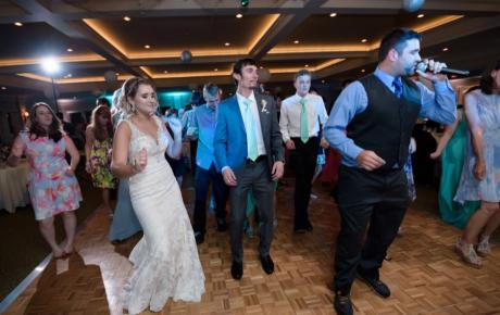 Wedding DJ leading the Cupid Shuffle at Abenaqui Country Club - Rye NH. Photo by Rick Bouthiette Photography